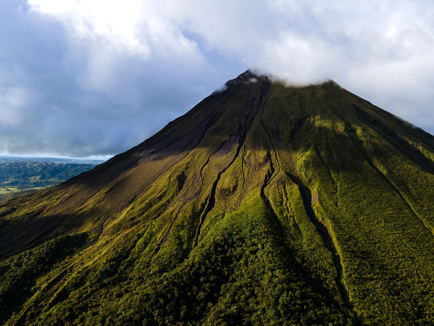 Beautiful aerial view of the Arenal Volcano, the arenal Lagoon, and rain forest in Costa Rica